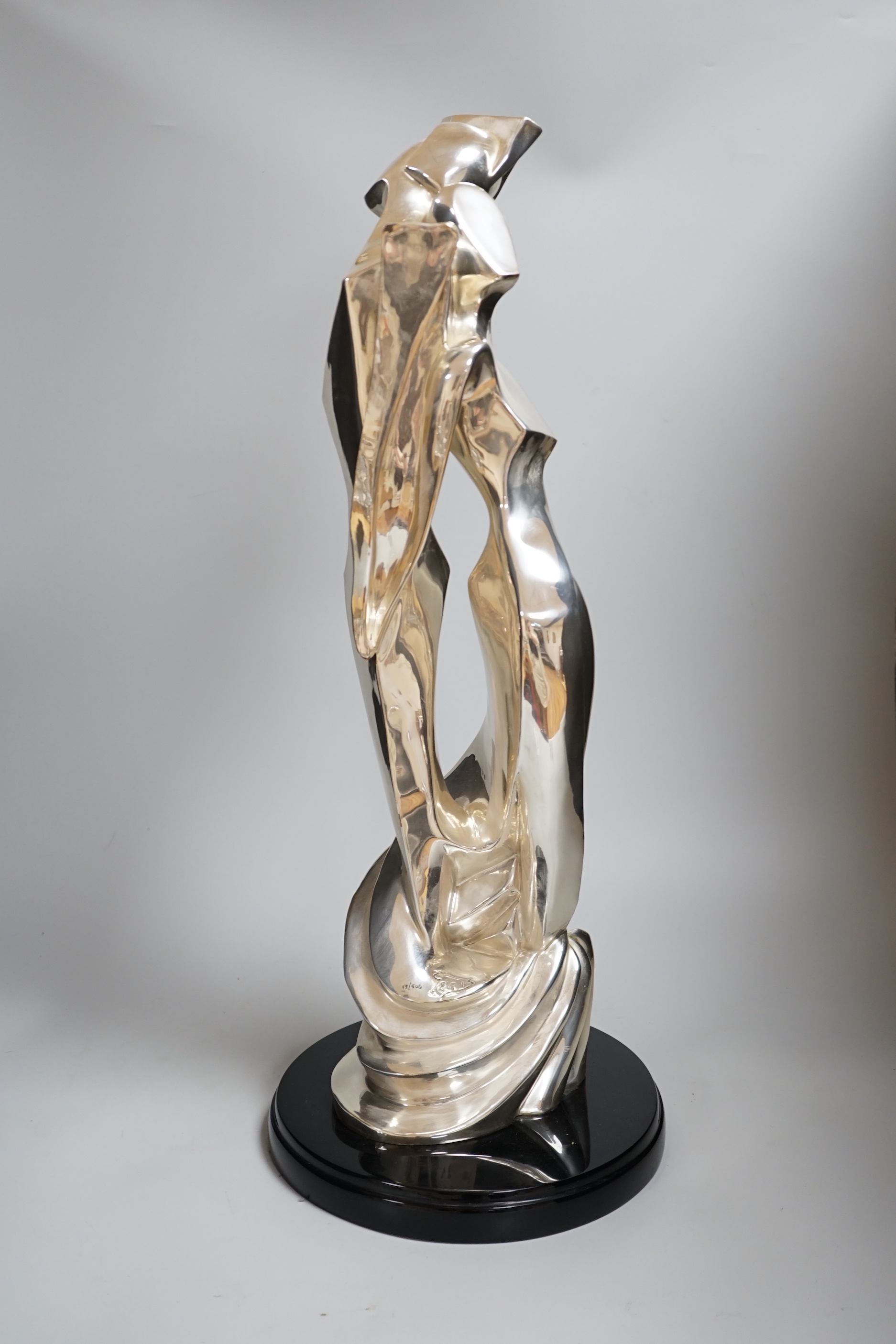 A plated abstract figural sculpture on stand, signed Geris, 45/500, 59cm